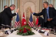 US President Barack Obama (right) greets his Turkish counterpart Recep Tayyip Erdogan ahead of a meeting in Paris, on December 1, 2015 World leaders opened an historic summit in the French capital with "the hope of all of humanity" laid on their shoulders as they sought a deal to tame calamitous climate change