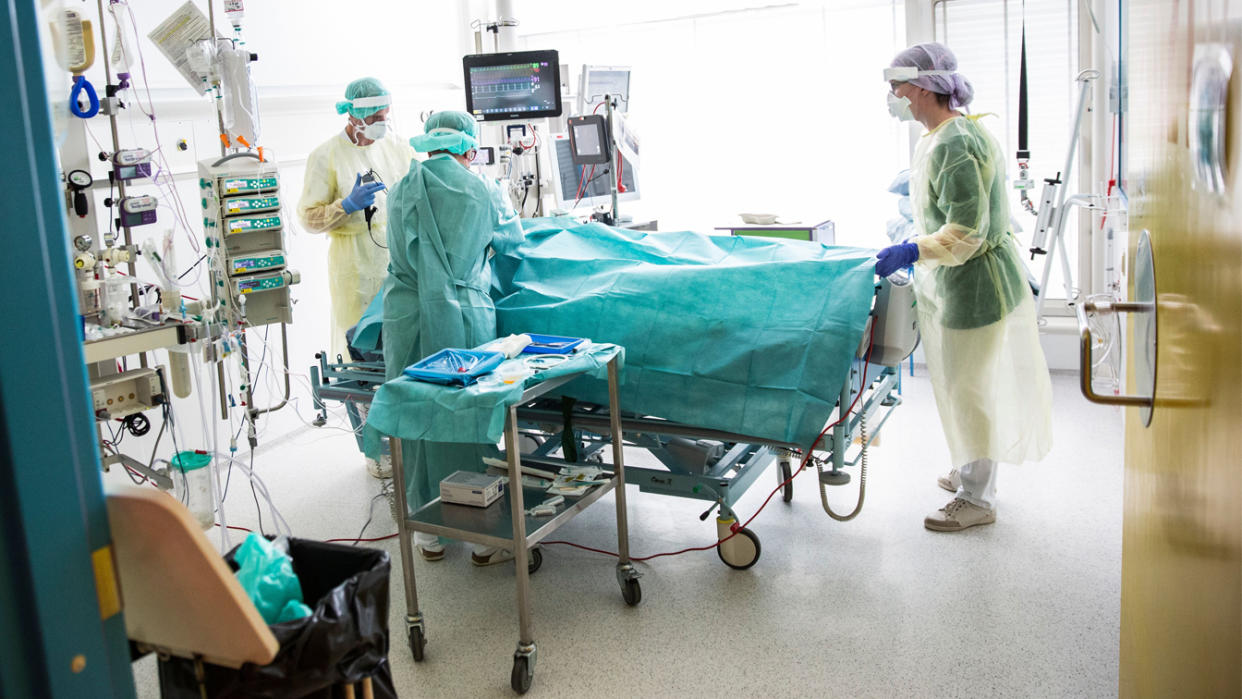 A patient with COVID-19 is operated on after the patient's respiration stopped during hospitalization at Herlev Hospital's Department of Anesthesia, Operation and Intensive Care, near Copenhagen, in May 2020. (Olafur Steinar Gestsson/Ritzau Scanpix/AFP via Getty Images)