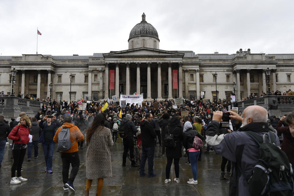 Protestors gather in Trafalgar Square, during a coronavirus anti-lockdown protest, in London, Saturday, Oct. 24, 2020. (AP Photo/Alberto Pezzali)