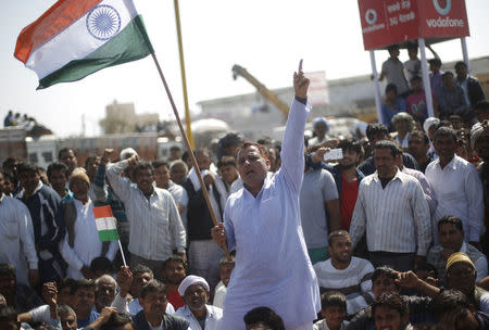 Demonstrators from the Jat community shout slogans as they block the Delhi-Haryana national highway during a protest at Sampla village in Haryana, India, February 22, 2016. REUTERS/Adnan Abidi