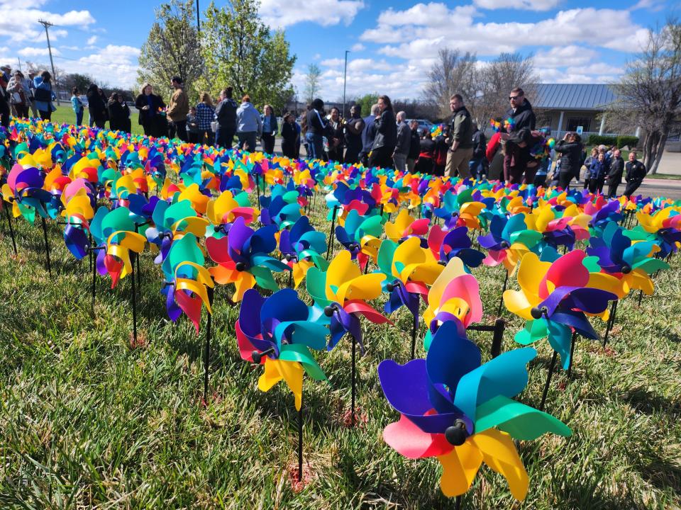 The Bridge plants 1,021 pinwheels on their front lawn representing each child they served throughout 2023 as a part of national child abuse awareness month.