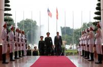U.S. Defense Secretary Mark Esper and Vietnam's Defence Minister General Ngo Xuan Lich enter the meeting room in Hanoi