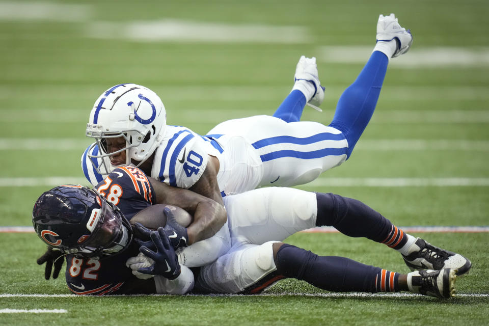 Chicago Bears wide receiver Daurice Fountain (82) is tackled by Indianapolis Colts cornerback Jaylon Jones (40) during the first half of an NFL preseason football game in Indianapolis, Saturday, Aug. 19, 2023. (AP Photo/Michael Conroy)