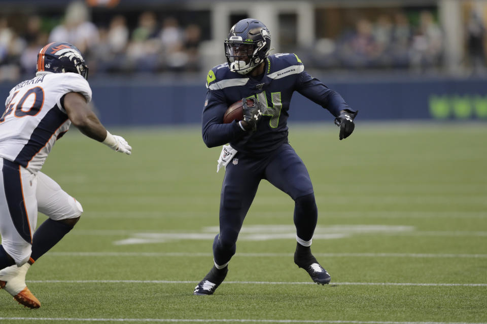 Seattle Seahawks wide receiver DK Metcalf runs the ball after a reception against the Denver Broncos during the first half of an NFL football preseason game Thursday, Aug. 8, 2019, in Seattle. (AP Photo/Stephen Brashear)