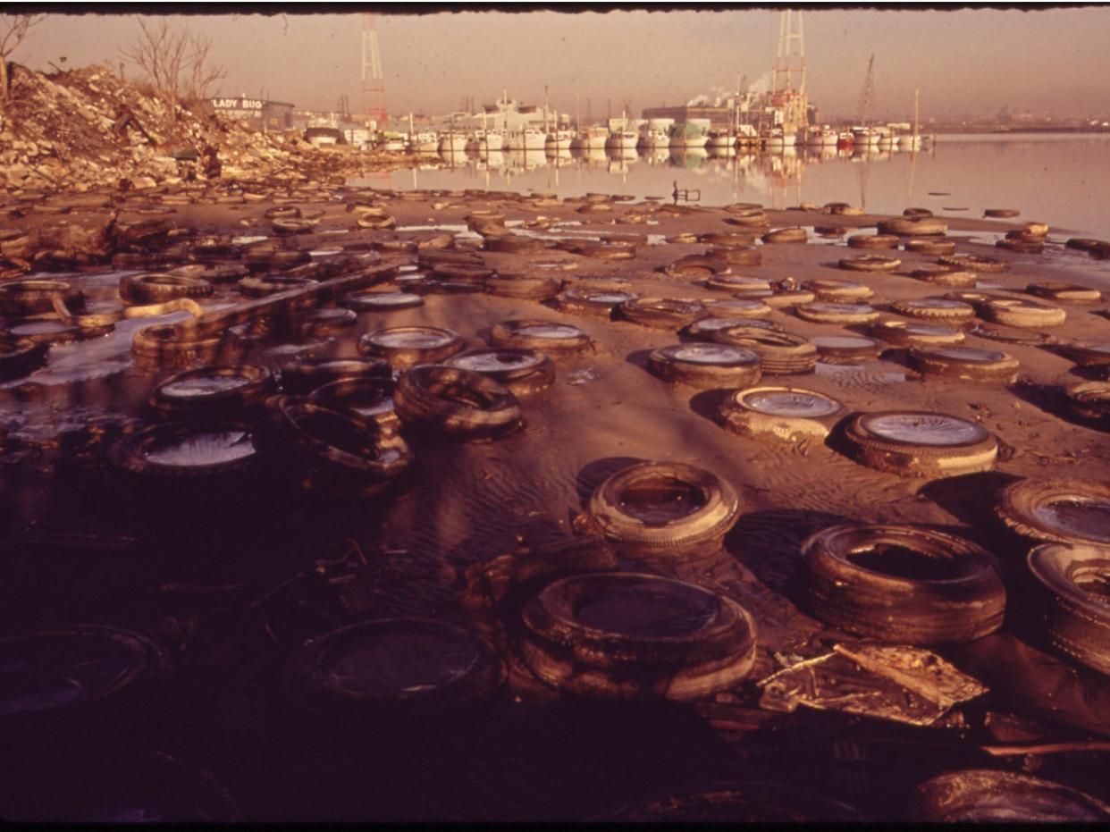 Trash and Old Tires Litter the Shore at the Middle Branch of Baltimore Harbor, 01/1973.