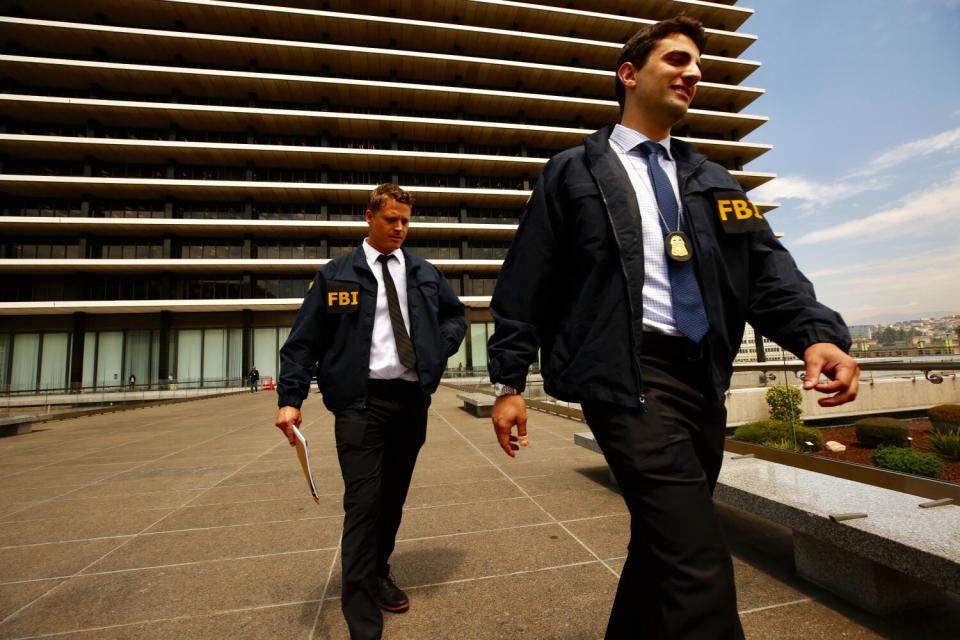 FBI agents outside DWP headquarters in 2019.