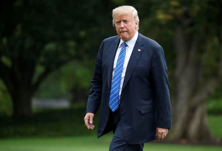 U.S. President Donald Trump walks from Marine One as he returns from Kansas City, Missouri, to the White House in Washington, U.S., July 24, 2018. REUTERS/Joshua Roberts