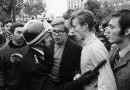 <p>On the Quai d’Orsay at the Pont des Invalides, students come face-to-face with a baton-wielding riot policeman in Paris on May 7, 1968. (Photo: Gökşin Sipahioğlu/SIPA) </p>