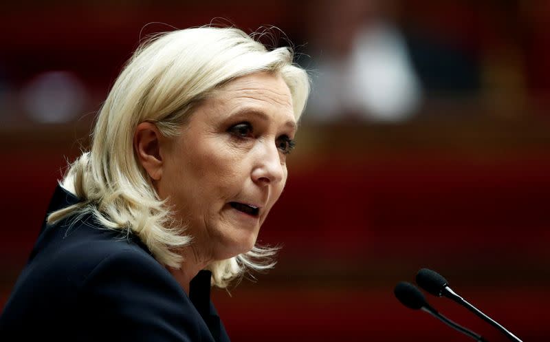 Marine Le Pen, member of parliament and leader of French far-right National Rally (Rassemblement National) party, delivers a speech during a debate on migration at the National Assembly in Paris