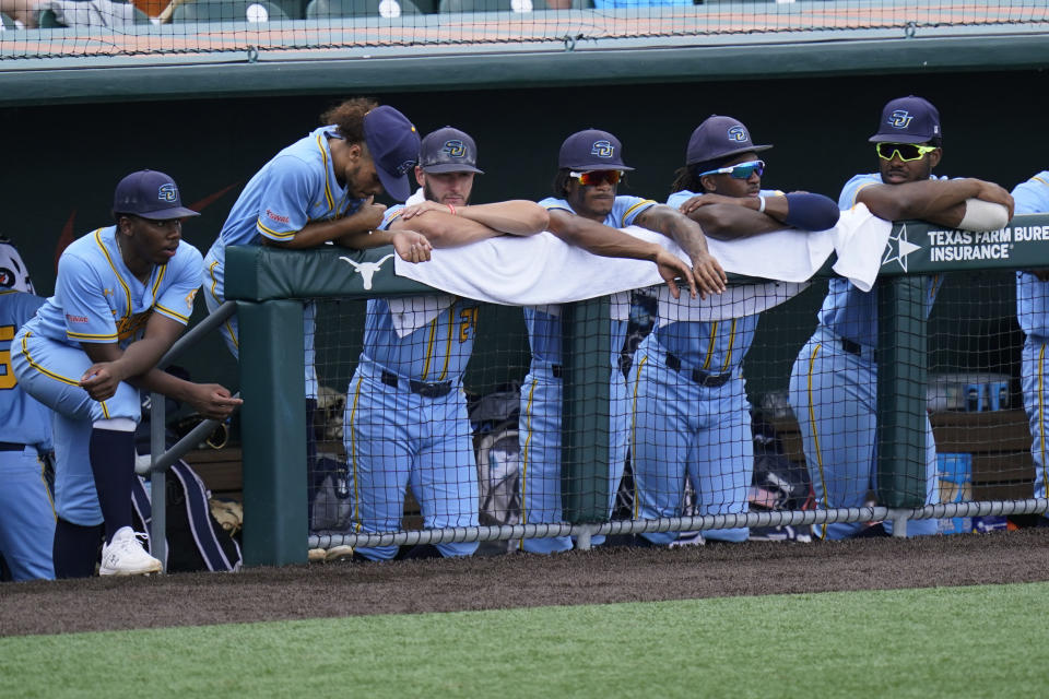 Southern players watch from the dugout in the eighth inning of an NCAA regional tournament college baseball game, against Texas, Friday, June 4, 2021, in Austin, Texas. (AP Photo/Eric Gay)