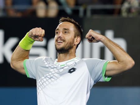 Viktor Troicki of Serbia reacts after winning the men's singles final match against Mikhail Kukushkin of Kazakhstan at the Sydney International tennis tournament in Sydney, January 17, 2015. REUTERS/Jason Reed