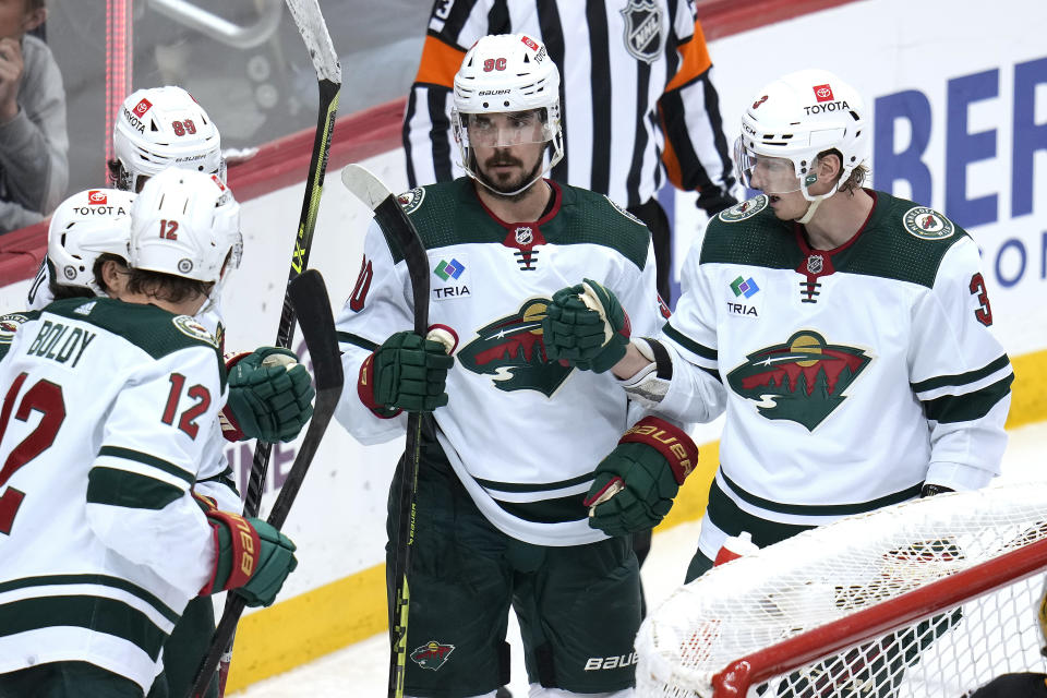 Minnesota Wild's Marcus Johansson (90) celebrates after his goal during the third period of an NHL hockey game against the Pittsburgh Penguins in Pittsburgh, Thursday, April 6, 2023. (AP Photo/Gene J. Puskar)