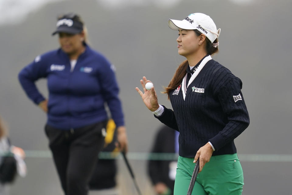 Minjee Lee, right, reacts after sinking a putt on the 15th green during the first round of the LPGA's Palos Verdes Championship golf tournament on Thursday, April 28, 2022, in Palos Verdes Estates, Calif. (AP Photo/Ashley Landis)