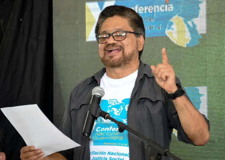 Commander Ivan Marquez gestures as he reads a statement next to other leaders to announce the approval of the peace deal with the government