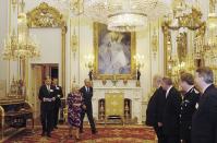 <p>As soon as the Queen enters the room, everyone <a rel="nofollow noopener" href="http://www.eonline.com/shows/the_royals/news/610777/8-things-you-should-never-do-when-meeting-the-royals" target="_blank" data-ylk="slk:must stand to greet her;elm:context_link;itc:0;sec:content-canvas" class="link ">must stand to greet her</a> and should not sit down until she does. Only then is it polite to take a rest. </p>