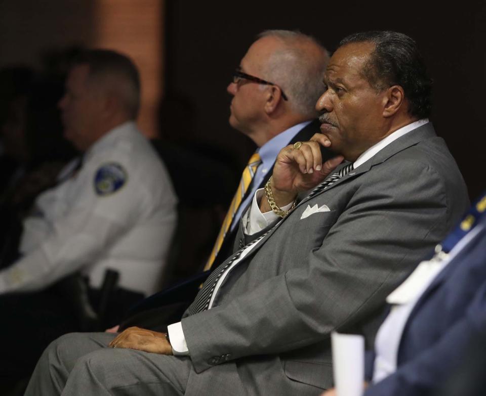 Akron Deputy Mayor Marco Sommerville, right, watches the body-camera videos from the fatal police shooting of Jayland Walker as he sits next to Mayor Dan Horrigan during a press conference Sunday.