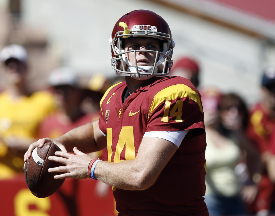 USC quarterback Sam Darnold warms up before an NCAA college basketball game against Oregon State. (AP)