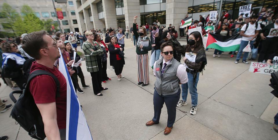 Iowa State University officials block supporters of Israel and supporters of Palestinians during a demonstration against the Israel-Hamas war at the university's central campus on Wednesday, May 1, 2024, in Ames, Iowa