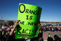 A woman holds up her sign as she enters Sam Boyd Stadium for the Women's March rally in Las Vegas, Nevada, U.S. January 21, 2018. REUTERS/Steve Marcus