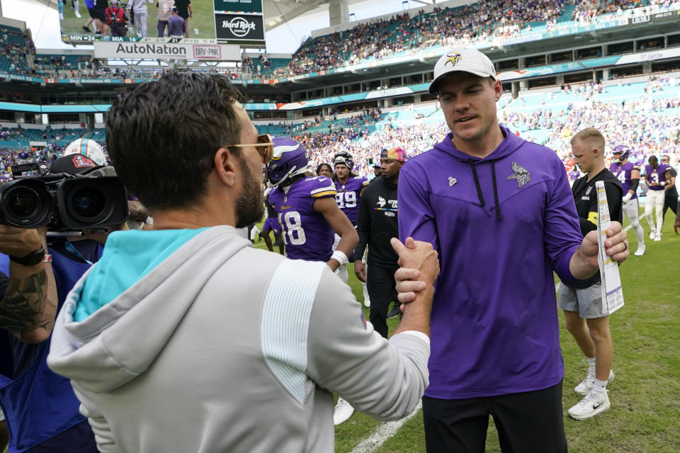 Minnesota Vikings head coach Kevin O'Connell, right, greets Miami Dolphins head coach Mike McDaniel after the end of an NFL football game, Sunday, Oct. 16, 2022, in Miami Gardens, Fla. (AP Photo/Wilfredo Lee)