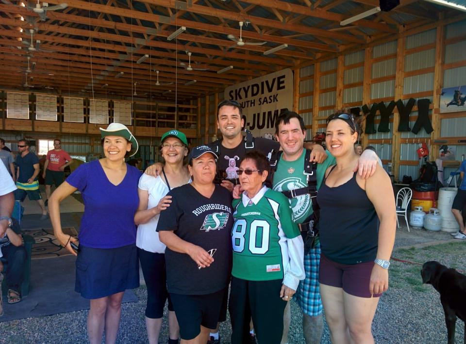 Joel D. Montgrand, middle back row, stands with his family in Saskatchewan.