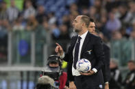 Lazio's head coach Igor Tudor holds the ball as he gives instructions during the Serie A soccer match between Lazio and Juventus at Rome's Olympic Stadium, Saturday, March 30, 2024. (AP Photo/Andrew Medichini)