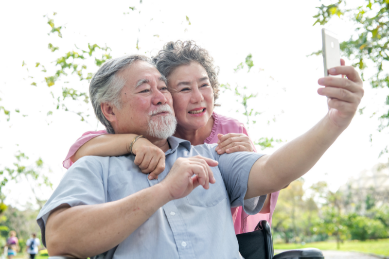 Old Couple Looking at Mobile Phone