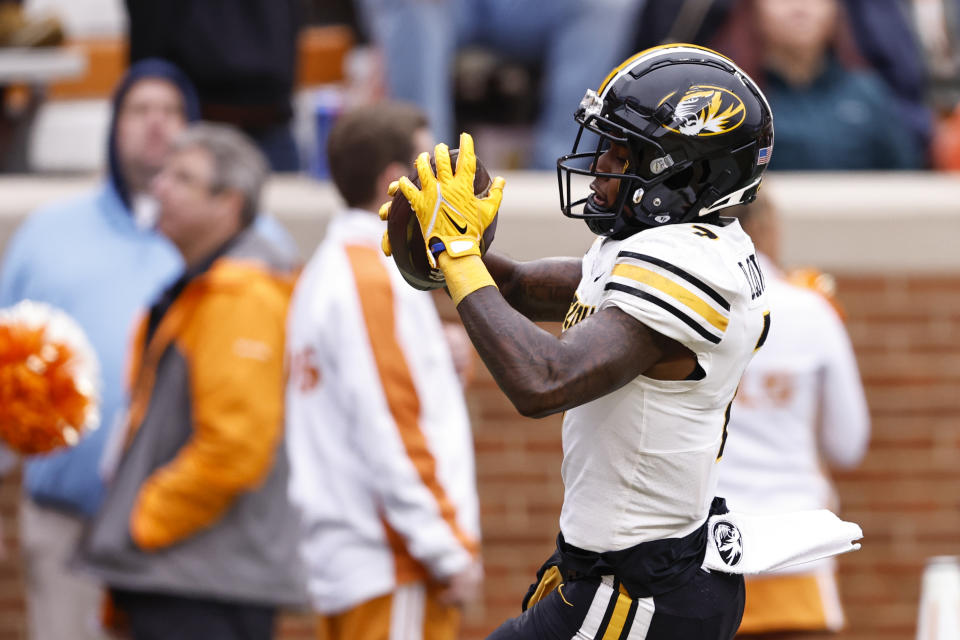 Missouri wide receiver Dominic Lovett (7) runs for a touchdown during the second half of an NCAA college football game against Tennessee Saturday, Nov. 12, 2022, in Knoxville, Tenn. (AP Photo/Wade Payne)