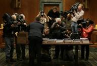 U.S. President Barack Obama's fiscal year 2015 budget proposal is captured by the media after being delivered to the Senate Budget Committee on Capitol Hill in Washington March 4, 2014. REUTERS/Gary Cameron