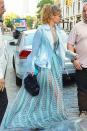 <p>Heading to JFK airport to catch a flight to Toronto, where she's hosting the Much Music Video Awards, in a sheer blue gown and moto-style jacket. </p>