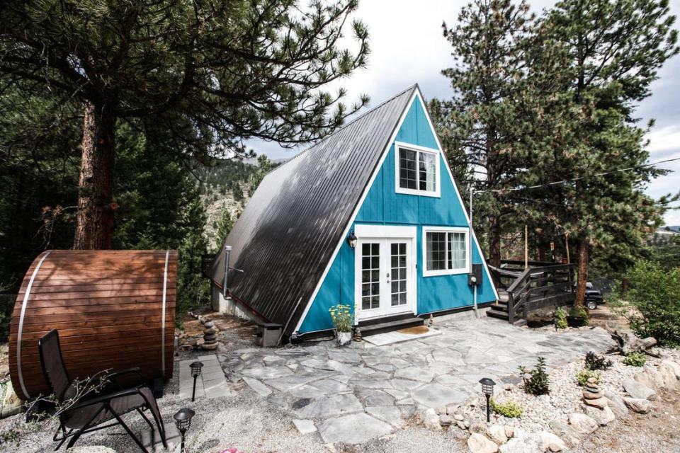 The Hygge Chalet and sauna is nestled on 3.5 wooded acres in Grant, Colorado.