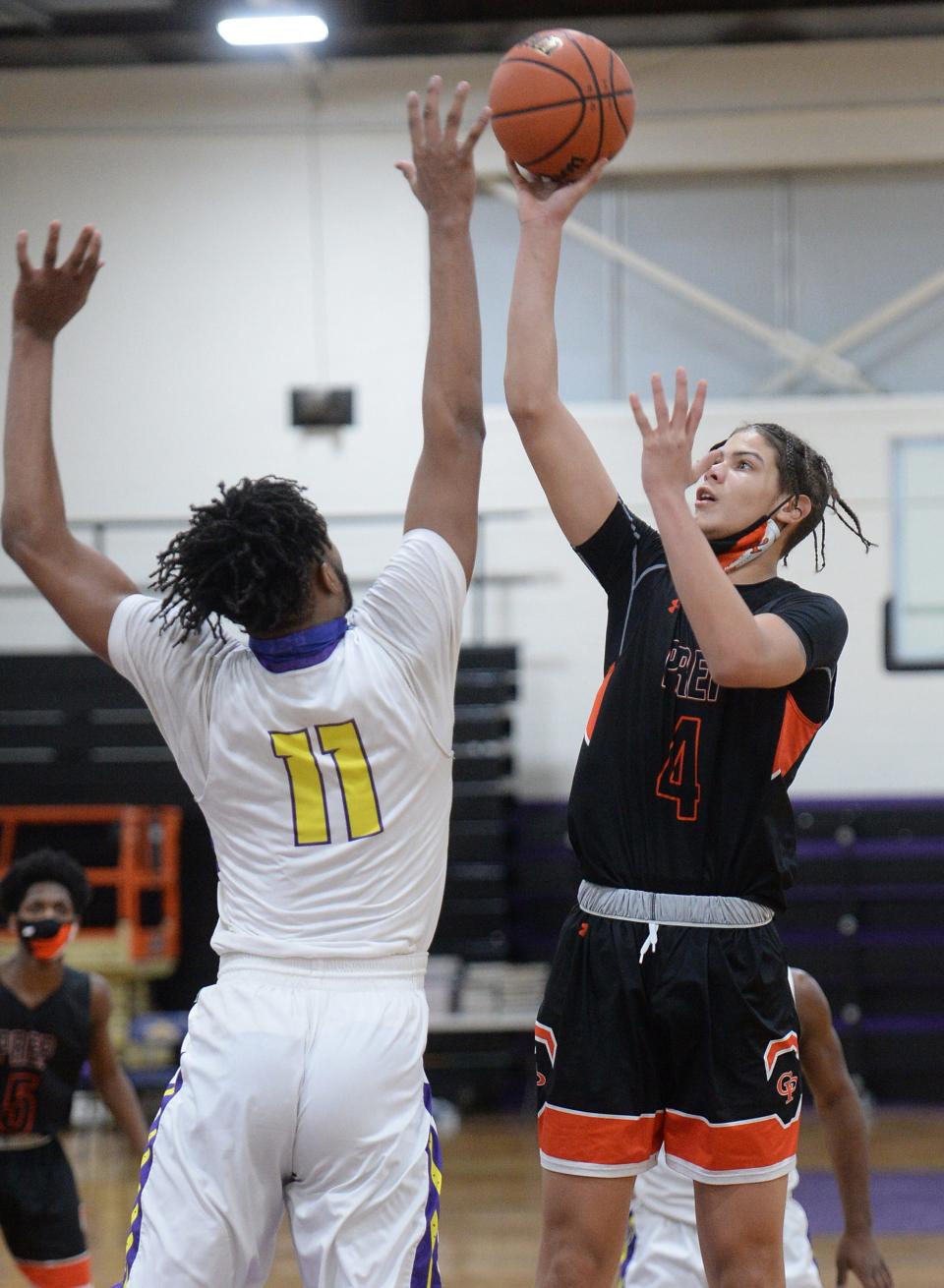 Cathedral Prep's Khali Horton shoots over Erie High's Marquell Darnell on Feb. 9, 2021 in the District 10, Region 6 game at Erie High School.