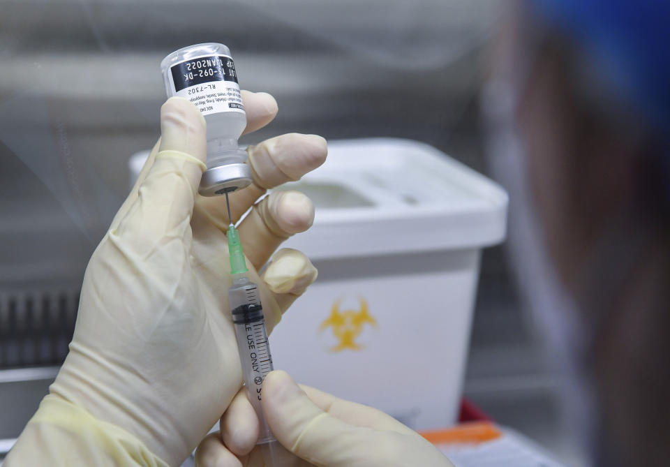 A nurse fills a syringe with the Pfizer BioNTech COVID-19 vaccine at the National Medical Center vaccination center in Seoul Saturday, Feb. 27, 2021. (Song Kyung-Seok/Pool Photo via AP)