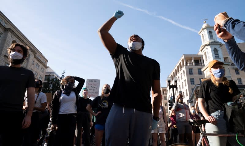 Protestors peacefully protest minutes before riot police cleared them away for a photo opportunity by President Donald Trump in Washington