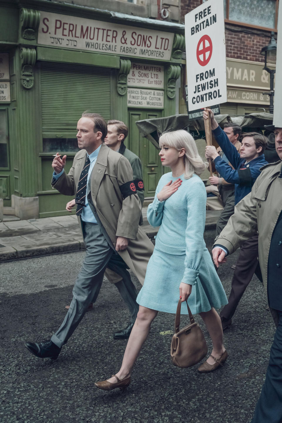 Programme Name: Ridley Road - TX: n/a - Episode: n/a (No. n/a) - Picture Shows:  Colin Jordan (RORY KINNEAR), Vivien Epstein (AGNES O'CASEY) - (C) Red Productions - Photographer: Ben Blackall