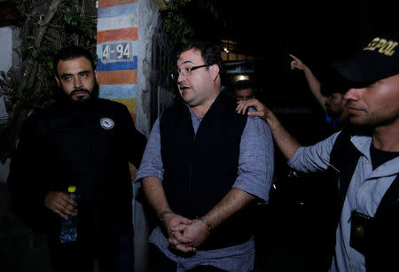 Former governor of Mexican state Veracruz Javier Duarte (C) is escorted by authorities after he was detained in a hotel in Panajachel, Guatemala 15 April 2017. REUTERS/Danilo Ramirez