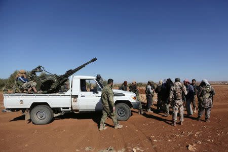 Rebel fighters gather during their advance towards the Islamic State-held city of al-Bab, northern Syria October 26, 2016. REUTERS/Khalil Ashawi