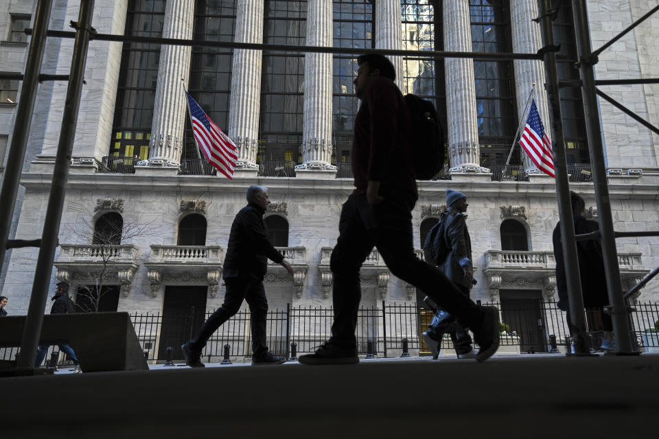 Photo by: NDZ/STAR MAX/IPx 2022 2/11/22 People walk past the New York Stock Exchange (NYSE) on Wall Street on February 11, 2022 in New York.