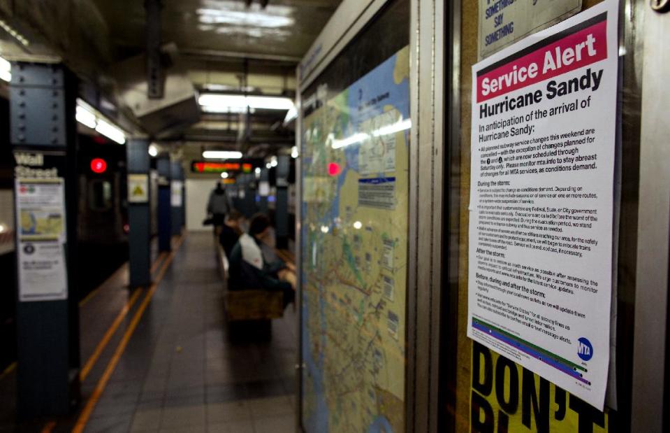 A sign informs subway riders of changes in service in the hours before the arrival of Hurricane Sandy in New York Sunday, Oct. 28, 2012. Areas in the Northeast Region prepared Sunday for the arrival of the hurricane and a possible flooding storm surge. (AP Photo/Craig Ruttle)