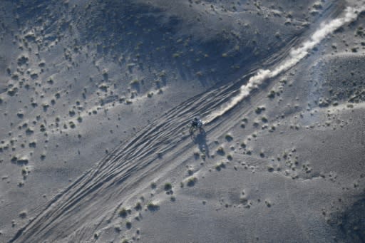 American Andrew Short threads his way through the desert on his way to second place in the motorbike category