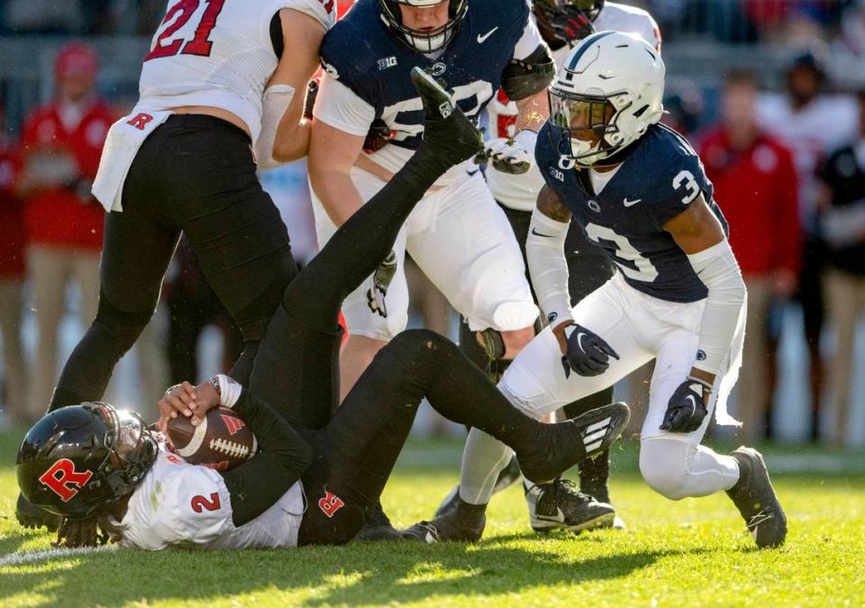 Penn State cornerback Johnny Dixon celebrates stopping Rutgers’ Gavin Wimsatt during the game on Saturday, Nov. 18, 2023.