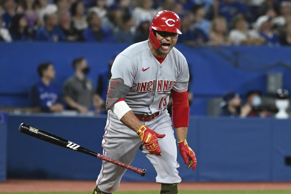 Cincinnati Reds' Hey Votto reacts after flying out against the Toronto Blue Jays during the first inning of a baseball game Friday, May 20, 2022, in Toronto. (Jon Blacker/The Canadian Press via AP)