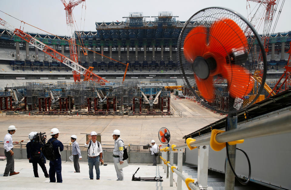 <p>Electrical fans are seen during a heat wave, at the construction site of the New National Stadium, the main stadium of the Tokyo 2020 Olympics and Paralympics, during a media opportunity in Tokyo, Japan July 18, 2018. (Photo: Issei Kato/Reuters) </p>