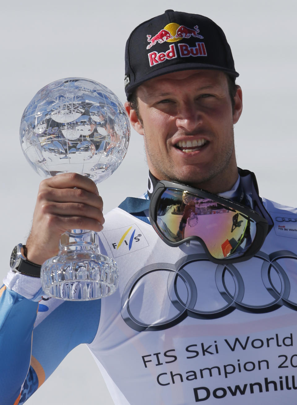 Norway's Aksel Lund Svindal shows the crystal globe trophy of the men's alpine skiing downhill at the World Cup finals in Lenzerheide, Switzerland, Wednesday, March 12, 2013. (AP Photo/Marco Trovati)