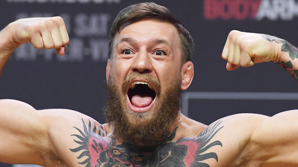 Conor McGregor is pictured here flexing his muscles for a photo shoot.