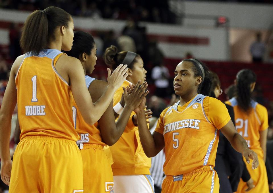 Tennessee guard Ariel Massengale (5) celebrates with her teammates as she leaves the game in the fianl moments of the second half of an NCAA college basketball game after the game against Georgia, Sunday, Jan. 5, 2014, in Athens, Ga. Tennessee won 85-70. (AP Photo/John Bazemore)