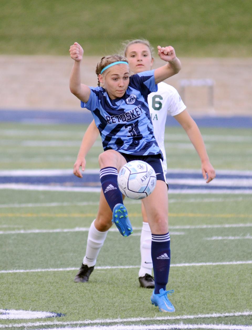 Petoskey's Clara Mailloux receives the ball during the first half against Alpena.
