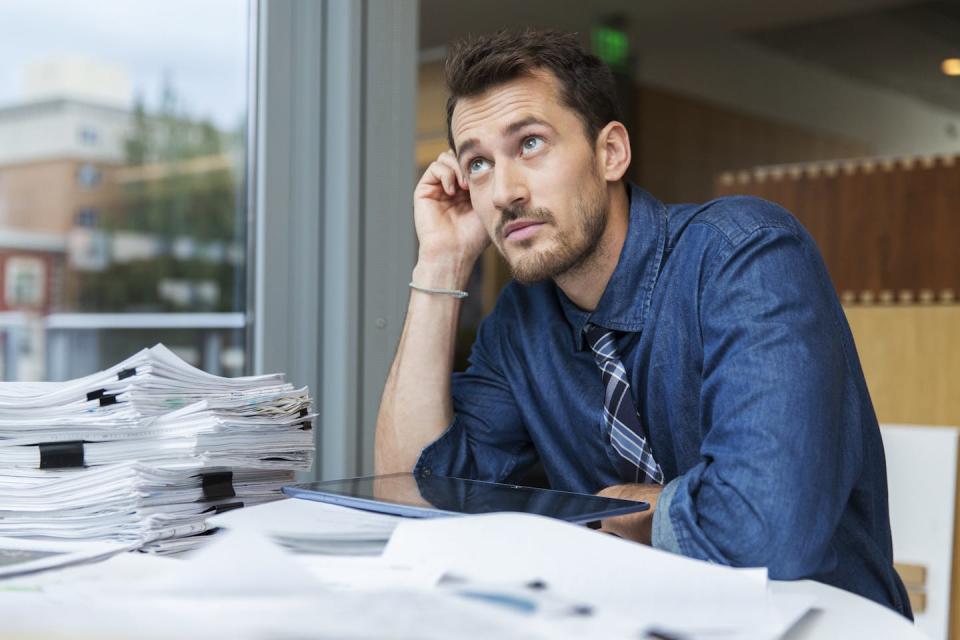 Many employees are doing just enough to get by. <a href="https://www.gettyimages.com/detail/photo/male-professional-at-desk-royalty-free-image/544371963?phrase=people+at+work+not+engaged&adppopup=true" rel="nofollow noopener" target="_blank" data-ylk="slk:Erik Von Weber via Getty Images;elm:context_link;itc:0;sec:content-canvas" class="link ">Erik Von Weber via Getty Images</a>