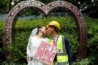 The Wider Image: On trial on riot charges, Hong Kong newlyweds prepared for life apart