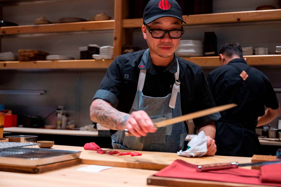 Kru Contemporary Japanese Cuisine chef and co-owner Billy Ngo prepares sushi Friday. Ngo was named a semifinalist for the James Beard Award.